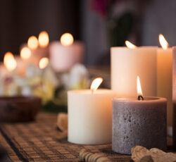 Closeup,of,burning,candles,spreading,aroma,on,table,in,a